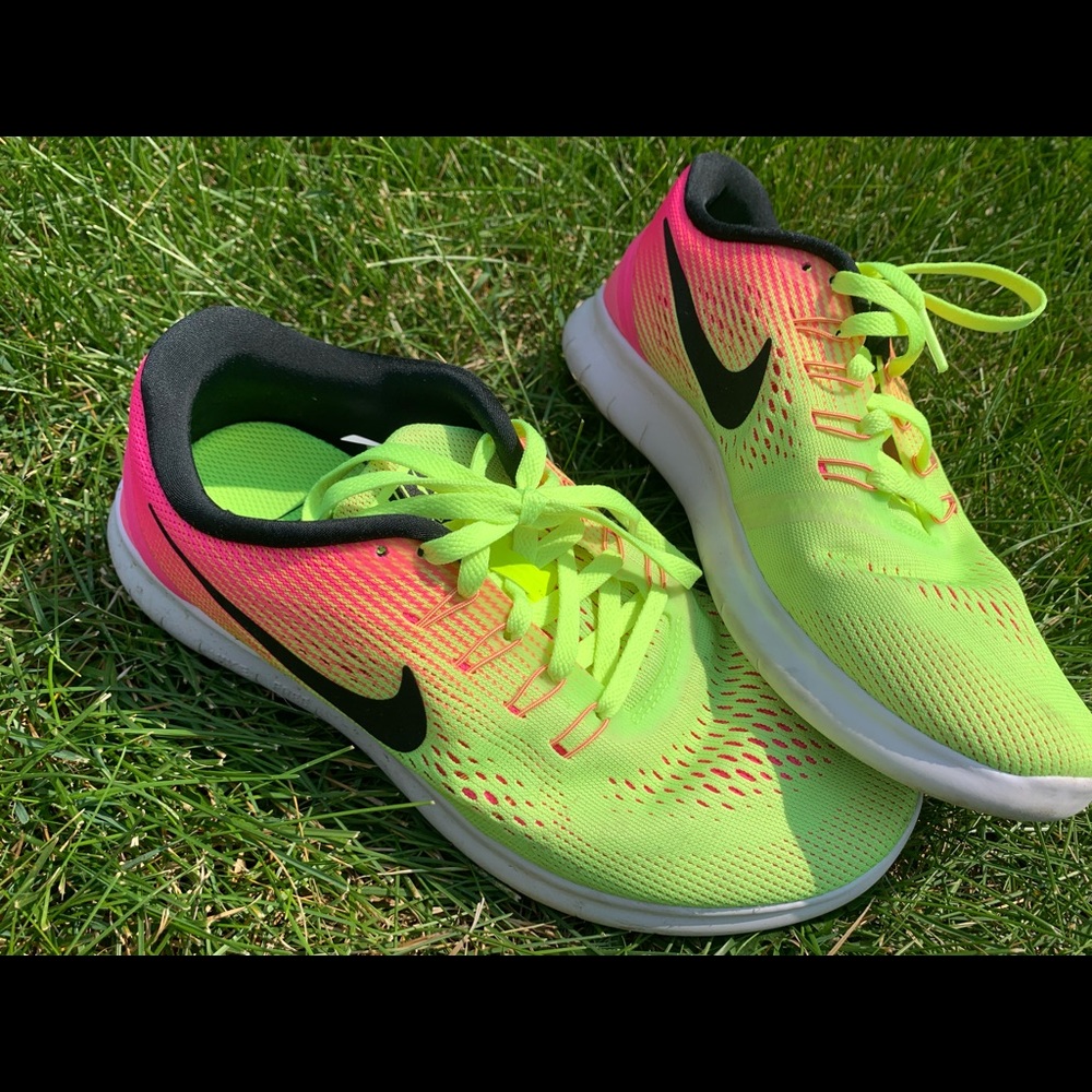 Pink and yellow Nike running shoes